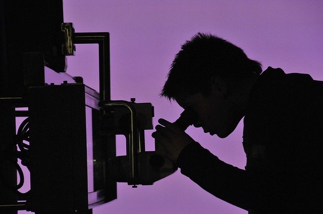 Boy looking through telescope
